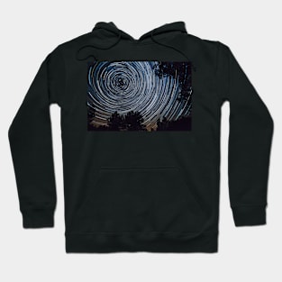 Starry night sky, startrails between trees landscape Hoodie